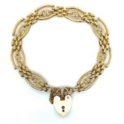 A 9ct HALLMARKED GOLD FANCY LINK GATE BRACELET. COMPLETE WITH SAFETY CHAIN AND PADLOCK CLASP. WEIGHT