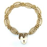 A 9ct HALLMARKED GOLD FANCY LINK GATE BRACELET. COMPLETE WITH SAFETY CHAIN AND PADLOCK CLASP. WEIGHT