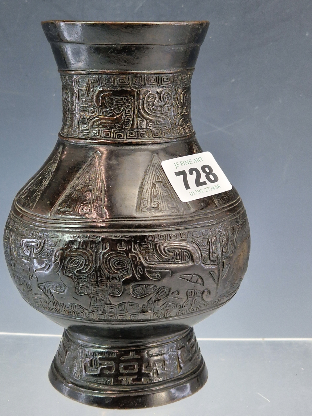 A CHINESE BRONZE BALUSTER VASE CAST WITH BANDS OF DAODIEH AND WITH CHEVRON LAPPETS ON THE SHOULDERS. - Image 3 of 6