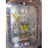 A FRAMED LEADED GLASS PANEL PAINTED WITH A BASKET OF FLOWERS. 85 x 66cms.