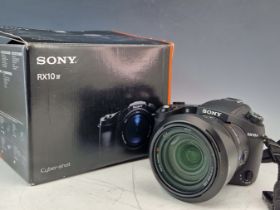 A SONY RX10 IV. CAMERA (BOXED)