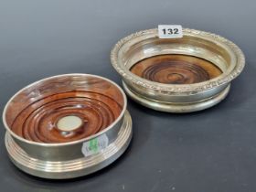 TWO HALLMARKED SILVER WINE COASTERS WITH WOODEN INSETS