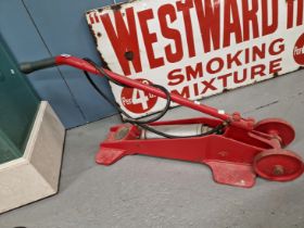 A WILLIAM TURNER RED PAINTED IRON KISMET TROLLEY COMPRESSOR