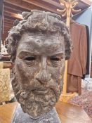 AFTER THE ANTIQUE, A BRONZE HEAD OF A BEARDED MAN RAISED ABOVE A GREY MARBLE PLINTH. H 43cms.