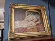 VICTORIAN SCHOOL, A BABY IN ITS BASKET WARE COT, OIL ON CANVAS. 64 x 76cms.
