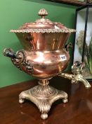 A VICTORIAN COPPER EPERGNE WITH TWO HANDLES FLANKING THE BRASS SPIGOT ABOVE THE BASE ON FOUR BUN