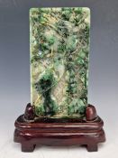 A CHINESE JADEITE RECTANGULAR PLAQUE CARVED ON ONE SIDE WITH A DRAGON, A FISH, A BAT AND LOTUS