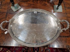 A WALKER AND HALL ELECTROPLATE OVAL TRAY WITH A BEADED RIM AND HANDLES. W 70cms.