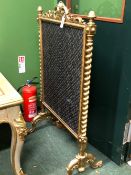 A LATE 19th C. GILT WOOD FIRE SCREEN WITH PIERCED FOLIATE CRESTING AND SPIRAL TWIST COLUMNS FLANKING