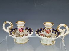 A PAIR OF EARLY 19th C. ENGLISH PORCELAIN CHAMBER STICKS, POSSIBLY COALPORT, THE WAVY BLUE AND