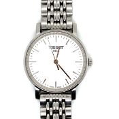 A TISSOT EVERYTIME QUARTZ WATCH. CASE DIAMETER 30mm, ON A STAINLESS STEEL STRAP. LENGTH 18.5cms.