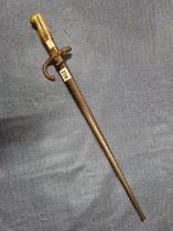 AN 1878 ST ETIENNE BAYONET IN AN IRON SCABBARD