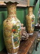 A PAIR OF ORIENTAL PORCELAIN VASES DECORATED IN SATSUMA PALETTE WITH PANELS OF PHEASANTS BELOW THE