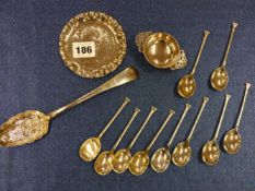 A SET OF TEN SEAL TOP COFFEE SPOONS, SHEFFIELD 1951, A SILVER BERRY SPOON, A MINIATURE QUAICH BY
