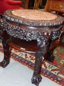 A CHINESE HARDWOOD STAND WITH A WAVY CIRCULAR PINK MARBLE INSET TOP ABOVE A TIER JOINING THE FOUR