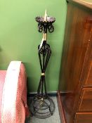 A PAIR OF FLOOR STANDING WROUGHT IRON PRICKET CANDLESTICKS ON STEPPED CIRCULAR FEET. H 113cms.