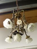 A FIVE LIGHT CHANDELIER EACH WITH FROSTED GLASS FLOWER FORM SHADES BELOW FOUR GLASS FLOWER HEADS