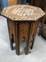 AN ISLAMIC OCTAGONAL TABLE GEOMETRICALLY INLAID IN EBONY, MOTHER OF PEARL AND SPECIMEN WOODS, THE