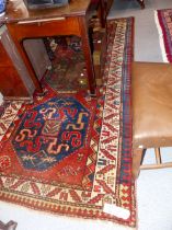 AN ANTIQUE CAUCASIAN KAZAK RUG. 267 x 130cms