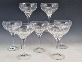 A SET OF EIGHT STUART CRYSTAL CHAMPAGNE GLASSES, A SET OF SIX CUT GLASS CHAMPAGNES AND SIX BRANDY