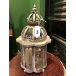 A SET OF FOUR ALUMINIUM AND CURVED GLASS CANDLESTICK LANTERNS WITH TWO TIER ONION DOME TOPS. H