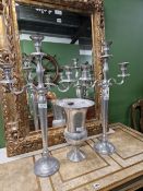 A PAIR OF ALUMINIUM THREE LIGHT CANDELABRA. H 79cms. TOGETHER WITH AN ALUMINIUM THISTLE SHAPED