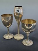 THREE HALLMARKED SILVER WINE GOBLETS WITH THAT OF TULIP SHAPE WEIGHTED, 453Gms.