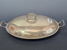 A SILVER SHALLOW OVAL TUREEN AND COVER BY ROBERT GARRARD, LONDON 1859, THE OVAL SHAPE WITH BEADED