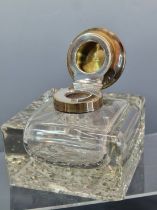 A SILVER MOUNTED SQUARE GLASS INKWELL BY DEAKIN AND FRANCIS, BIRMINGHAM 1922, THE FOOT OF THE