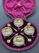 A CASED SET OF FOUR SILVER TUB SALTS AND SPOONS BY CHARLES STUART HARRIS, LONDON 1894, THE TRIPOD