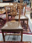 A SET OF SIX CHIPPENDALE TASTE WALNUT DINING CHAIRS WITH PIERCED BALUSTER SPLATS, LEATHER SEATS