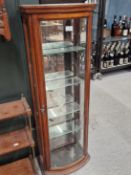 AN EARLY 20th C. BOW FRONT GLAZED MAHOGANY DISPLAY CABINET. W 30 x D 23.5 x H 107cms.