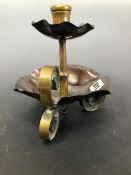 A BENSON STYLE COPPER AND BRASS TRIPOD CHAMBERSTICK WITH COPPER PETAL EDGED DRIP PAN AND UNDERTIER