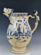 AN 18th C. CREAMWARE JUG WITH A LION MASK SPOUT AND MALE FIGURE THUMB PIECE, THE BALUSTER SIDES