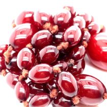 A GRADUATED OVAL BEAD NECKLACE OF CHERRY AMBER. GROSS WEIGHT 70.44grms. TOGETHER WITH A FURTHER