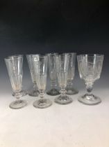 SEVEN CHAMPAGNE FLUTES, EACH ENGRAVED WITH CROWNED N TOGETHER WITH A GOBLET ENGRAVED WITH DOG AND