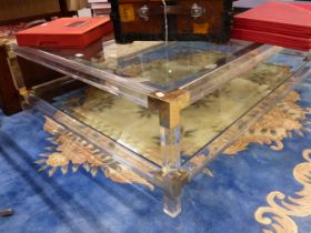 A MODERN BRASS CORNERED PERSPEX COFFEE TABLE. W 159 x D 112.5 x H 42cms.