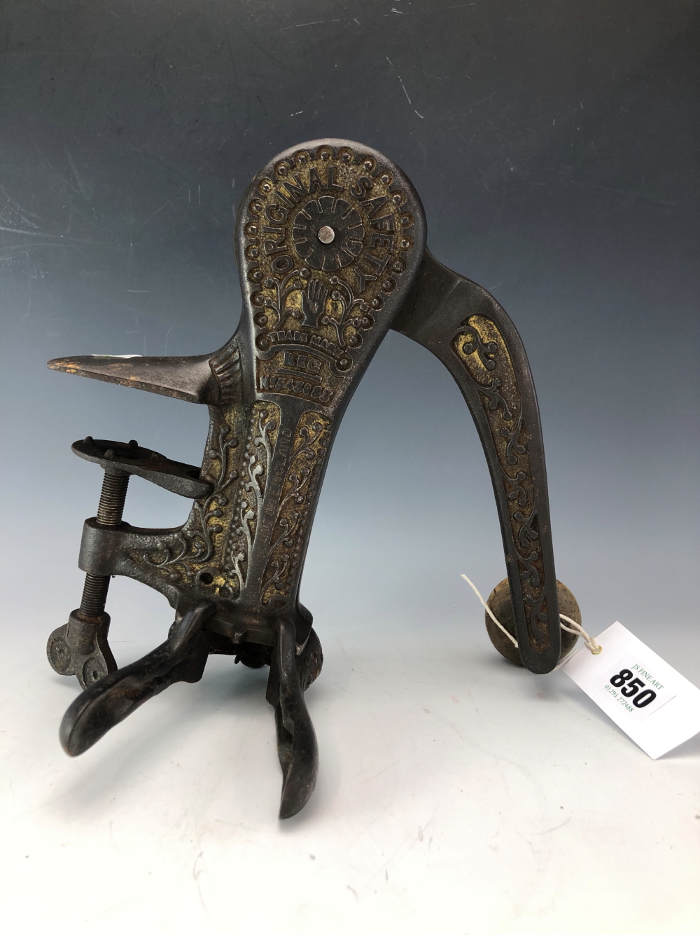 A VICTORIAN TABLE CLAMPING IRON CORKSCREW OPERATED BY A SUBSTANTIAL LEVER ARM