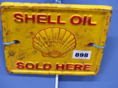 TWO CAST IRON SCALLOP SHELL SIGNS FOR GOLDEN SHELL MOTOR OIL. H 17cms. TOGETHER WITH ANOTHER