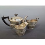 A SILVER THREE PIECE TEA SET BY NATHAN AND HAYES, CHESTER 1911, 376Gms.