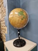 A 1960S PHILIPS CHALLENGE 13 1/2 INCH TERRESTRIAL GLOBE ON AND EBONISED STAND WITH A DISHED CIRCULAR
