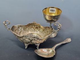 AN 800 SILVER GOBLET WITH FIGURES ON THE FOOT, A STERLING SILVER SERVING SPOON TOGETHER WITH AN