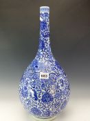 A CHINESE BLUE AND WHITE BOTTLE VASE PAINTED WITH DRAGONS AMONGST SCROLLING LOTUS. H 45cms.