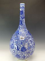 A CHINESE BLUE AND WHITE BOTTLE VASE PAINTED WITH DRAGONS AMONGST SCROLLING LOTUS. H 45cms.