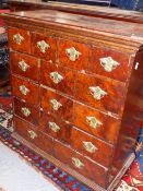A ANTIQUE YEW WOOD CHEST OF FOURTEEN DRAWERS ON BUN FEET. W 63 x D 32 x H 72cms