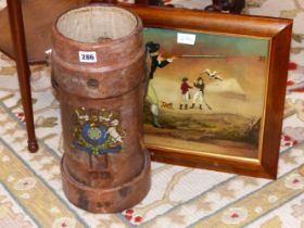 A BUSSEY & CO LEATHER SHOT CARRIER LATER PRINTED WITH AN ARMORIAL TOGETHER WITH A REVERSE GLASS