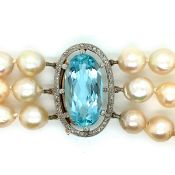 AN ANTIQUE THREE STRAND FRESHWATER PEARL, AQUAMARINE AND DIAMOND NECKLACE. THE THREE FRESHWATER