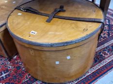 A LUTERMA RUSSIAN IRON RIM BANDED PLYWOOD CYLINDRICAL HAT BOX, THE LID SECURED BY A LEATHER STRAP