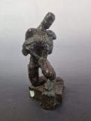 AN EARLY 20th C. BRONZE FIGURE OF A NUDE MAN ON ONE KNEE WITH A SHEEP IN HIS ARMS. H 26cms.