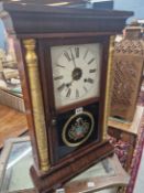 WATERBURY CLOCK CO, AN AMERICAN WEIGHT DRIVEN WALL CLOCK WITH A STRIKING MECHANISM, THE CASE WITH